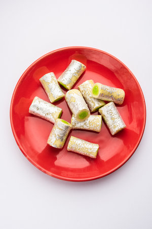 Kaju Pista Roll Or Cashew Pistachio Rolls Mithai or sigar, Indian sweet or dessert for festivalsの写真素材
