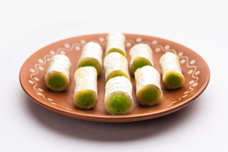 Kaju Pista Roll Or Cashew Pistachio Rolls Mithai or sigar, Indian sweet or dessert for festivals