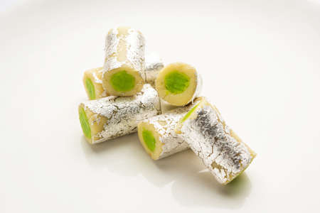 Kaju Pista Roll Or Cashew Pistachio Rolls Mithai or sigar, Indian sweet or dessert for festivalsの写真素材