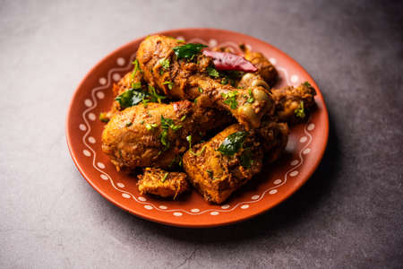 Sukha mutton or chicken, dry spicy Murgh or goat meat served in a plate or bowlの写真素材