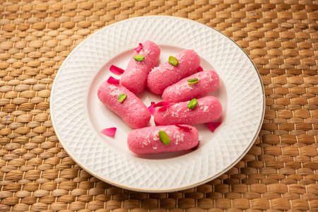 Pink Chumchum or rose flavoured chum chum or cham cham, indian and pakistani sweetの写真素材