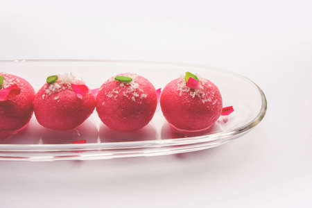 Delicious Pink Chumchum or rose flavour cham cham or Rasgulla or Rasagola, Rosogola, Rosogollaの写真素材
