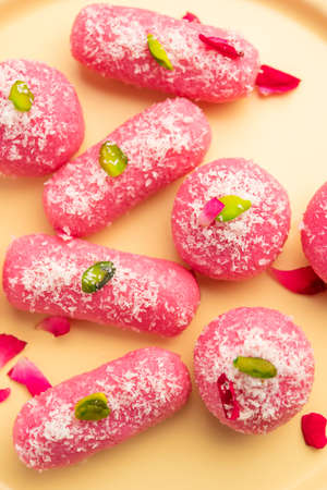 Pink Chumchum or rose flavoured chum chum or cham cham, indian and pakistani sweetの写真素材