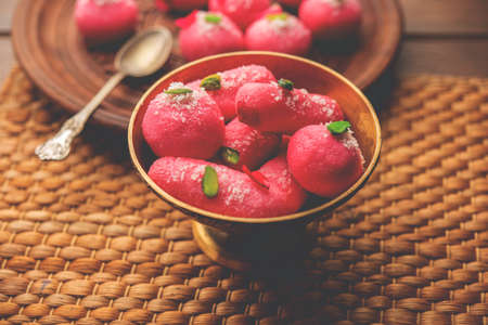 Pink Chumchum or rose flavoured chum chum or cham cham, indian and pakistani sweetの写真素材