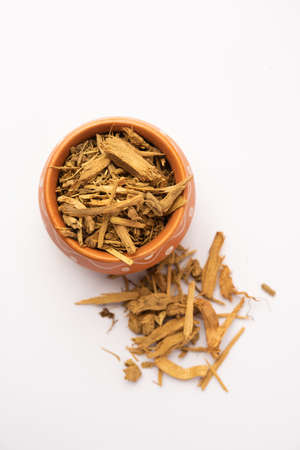 Ayurvedic Daruharidra - Daru haldi or tree turmeric isolated over white background