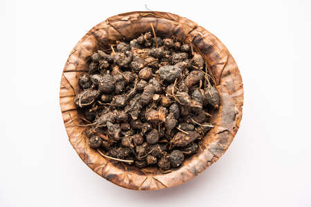 Ayurvedic Nagarmotha - Cyperus Scariosus or Cypriol in a bowl or heap