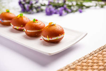 Malai Chop or Cream sandwich made using filling Rasgulla or Gulab jamun sweet is a Bengali sweet