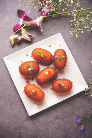 Malai Chop or Cream sandwich made using filling Rasgulla or Gulab jamun sweet is a Bengali sweet