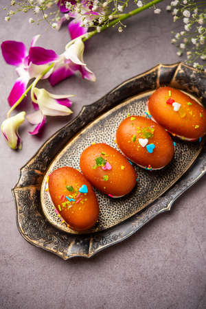 Malai Chop or Cream sandwich made using filling Rasgulla or Gulab jamun sweet is a Bengali sweet
