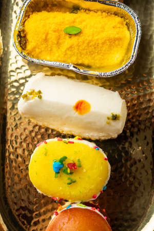 Malai Chop or Cream sandwich made using filling Rasgulla or Gulab jamun sweet is a Bengali sweetの写真素材
