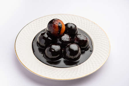 Chocolate dipped gulab jamun, indian creative fusion dessert foodの写真素材