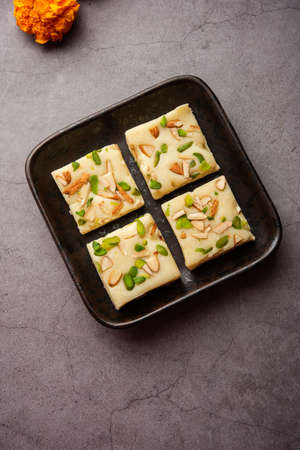Milk powder barfi also known as Mava burfi, white Khoya burfi or Barfee, Indian Sweet food