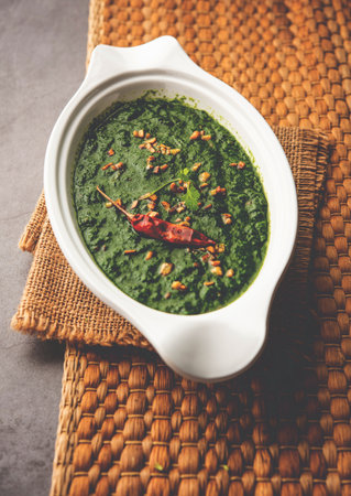 lasooni palak recipe or dhaba style garlic spinach curry, Indian main course served with naan
