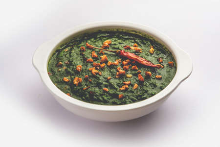 lasooni palak recipe or dhaba style garlic spinach curry, Indian main course served with naan