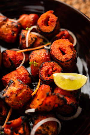 Tandoori Soya Chaap or soy chap dish prepared by marinating in tandoori spices, closeup view