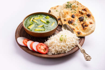 palak baby corn sabzi also known as spinach makai curry served with rice or roti, Indian food
