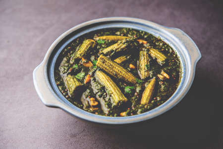 palak baby corn sabzi also known as spinach makai curry served with rice or roti, Indian food