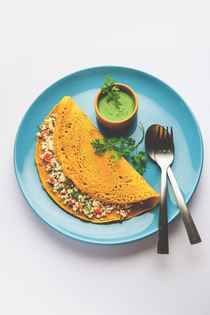 Paneer stuffed Besan chilla or Cheela made using chickpea flour with cottage cheese stuffingの写真素材
