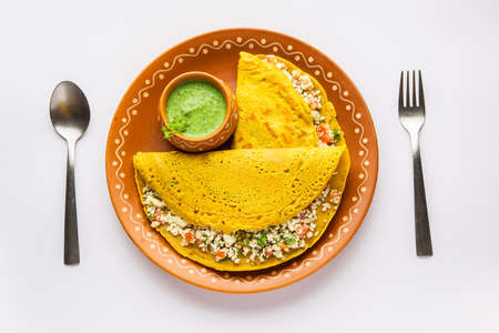 Paneer stuffed Besan chilla or Cheela made using chickpea flour with cottage cheese stuffingの写真素材