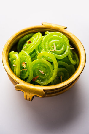Green Jalebi mithai or sweet from India, a Twist to a traditional imarti or jilbiの写真素材