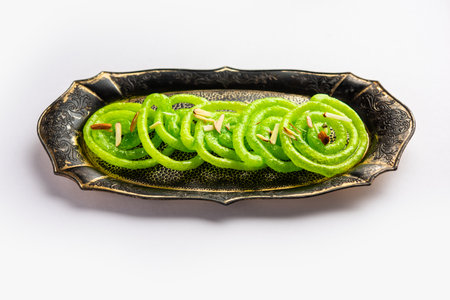 Green Jalebi mithai or sweet from India, a Twist to a traditional imarti or jilbiの写真素材
