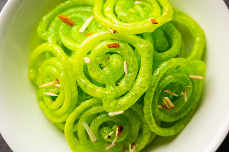 Green Jalebi mithai or sweet from India, a Twist to a traditional imarti or jilbiの写真素材