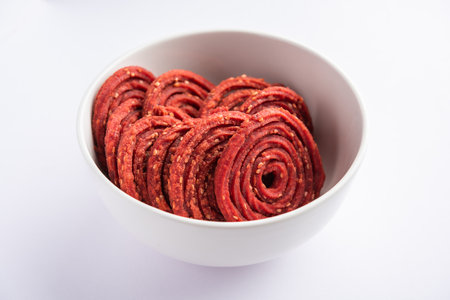 Beatroot chakli, murukku, Beetroot chakli, a spiral fried snack from India made in Diwali festivalの写真素材