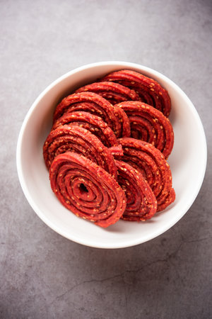 Beatroot chakli, murukku, Beetroot chakli, a spiral fried snack from India made in Diwali festivalの写真素材