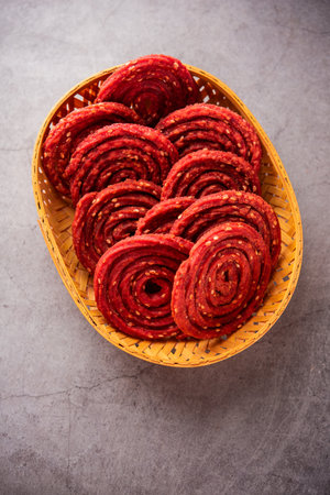 Beatroot chakli, murukku, Beetroot chakli, a spiral fried snack from India made in Diwali festivalの写真素材