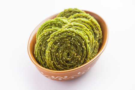 Palak Chakli or Spinach Murukku, healthy Indian festival or tea time snackの写真素材