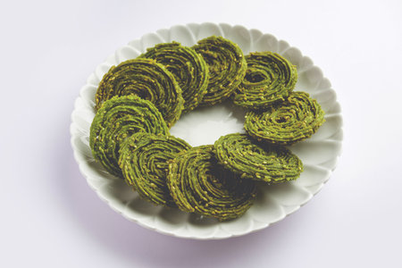 Palak Chakli or Spinach Murukku, healthy Indian festival or tea time snackの写真素材