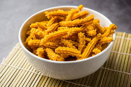 Bhajni chakli sticks or crunchy murukku snack made using diwali festival, favourite munching foodの写真素材