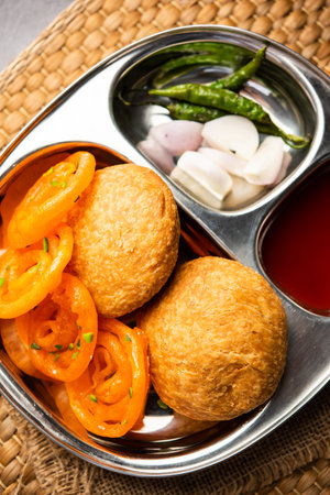 Kachori with Jalebi, snack combination from India also called kachauri, kachodi, katchuri, imarti