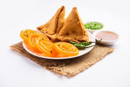 Veg Samosa with Jalebi, snack combination also called imarti and Sambusa, samusaの写真素材