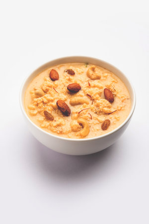 Nolen Gurer Chanar Payesh or Milk pudding of cottage cheese, rice and jaggery, bengali sweet recipeの写真素材