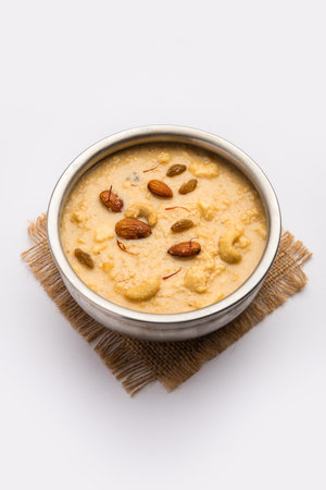 Nolen Gurer Chanar Payesh or Milk pudding of cottage cheese, rice and jaggery, bengali sweet recipeの写真素材