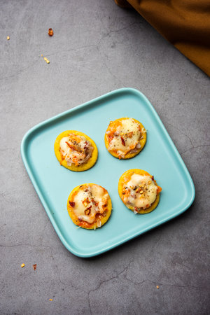 Papdi pizza are mini food bites, Indian kids favourite party snackの写真素材