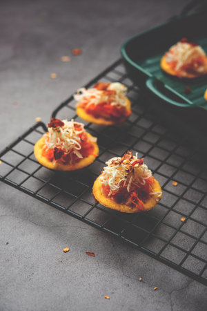 Papdi pizza are mini food bites, Indian kids favourite party snackの写真素材