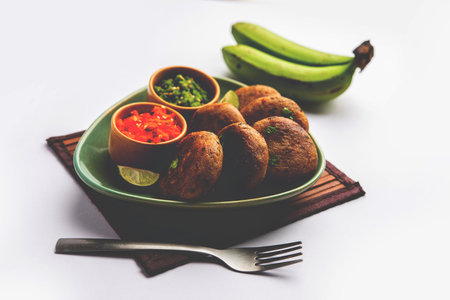 Raw Banana Cutlet also called plantain or kacche kele ki tikki or patties, served with chutneyの写真素材