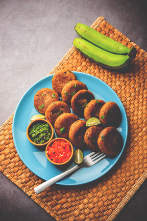Raw Banana Cutlet also called plantain or kacche kele ki tikki or patties, served with chutneyの写真素材