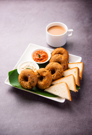 Instant leftover bread medu vada served with chutney and hot tea, Indian breakfast or snack recipe