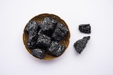 Shilajit is an ayurvedic medicine found primarily in the rocks of the Himalayas. selective focus