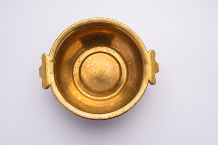 Empty Brass bowl or antique handi, isolated over white backgroundの写真素材
