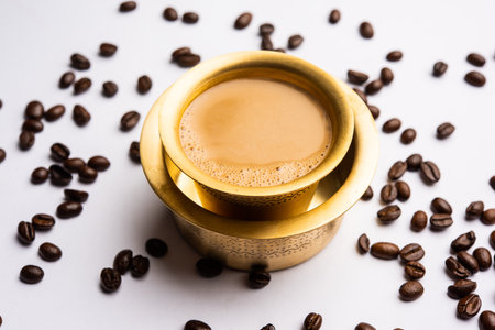 South Indian Filter coffee served in a traditional brass or stainless steel cupの写真素材