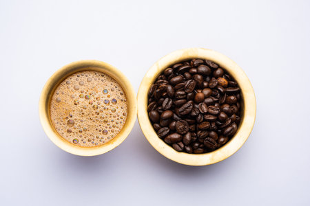 South Indian Filter coffee served in a traditional brass or stainless steel cupの写真素材