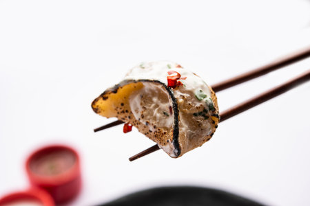 Tandoori momo, veg or non veg in red and cream sauce, served with sauce.  Nepal and Tibet recipeの写真素材