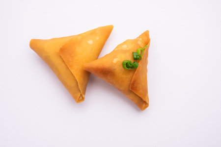 cocktail mini triangle samosa made using patti or strip, popular home made snack from Indiaの写真素材