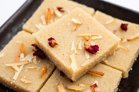 Rava barfiÂ or sooji burfi orÂ barfeeÂ is an Indian Sweet made with semolina, sugar, ghee and...