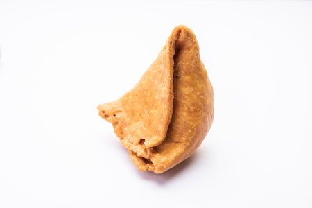 samosa or singara. Indian fried or baked pastry with a savory filling, spiced potatoes, onion, peas