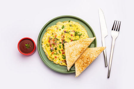 Bread Masala Omelette or OmletteÂ with hot tea Indian style